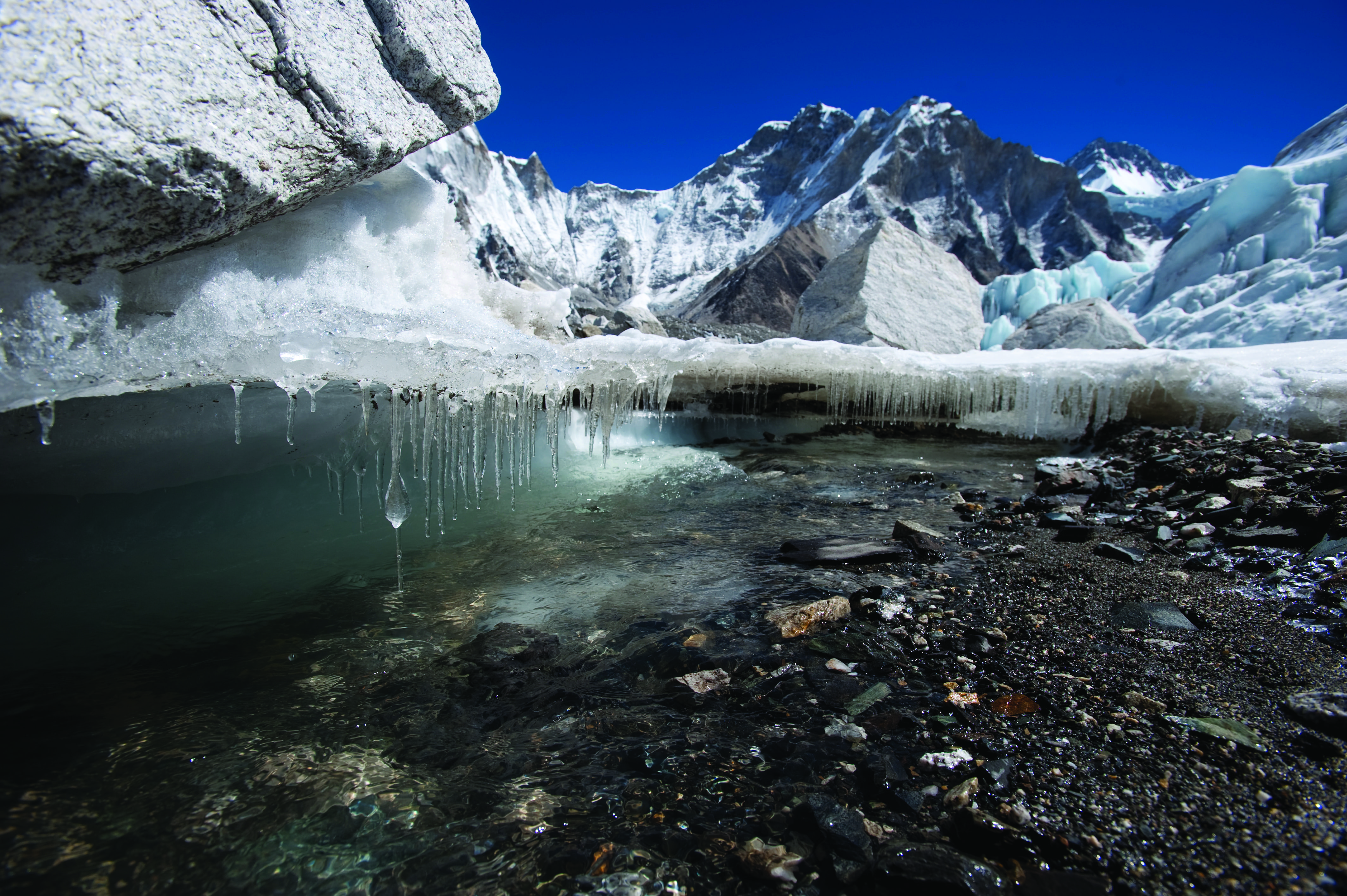 water melting from mountain's ice caps